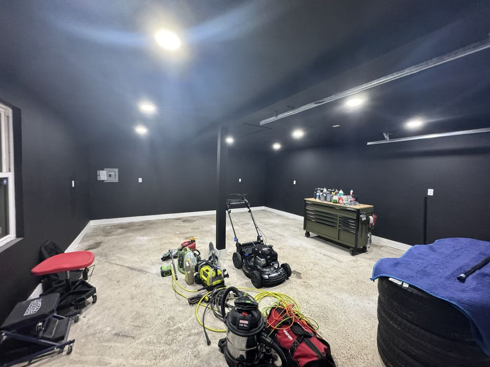 Garage with new recessed LED lighting and finished dark walls